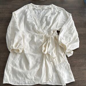 Cream colored quarter sleeve wrap dress